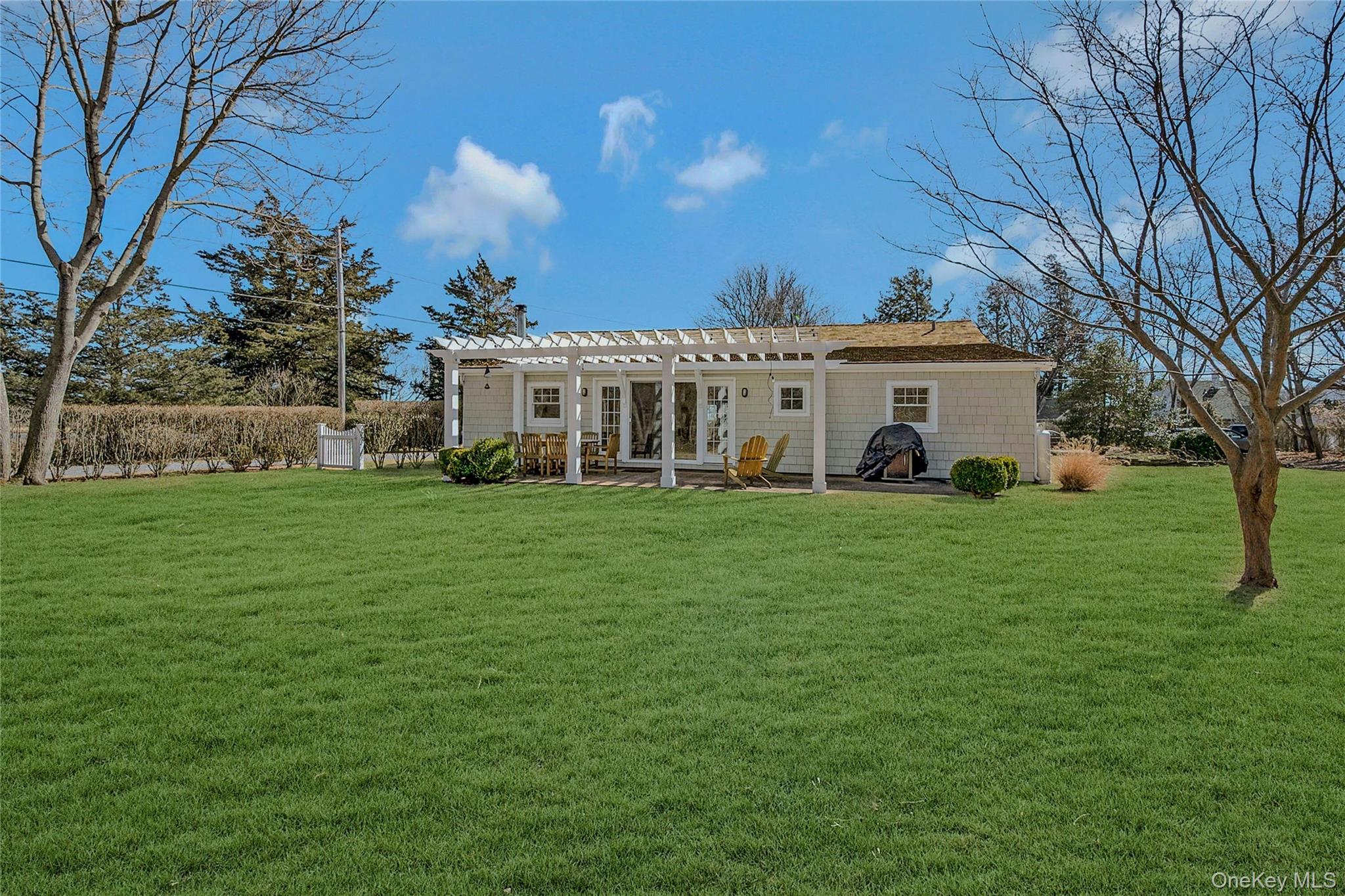 635 Strohson Road Cutchogue, NY 11935 - Photo 27 of 32 a view of a house with a big yard