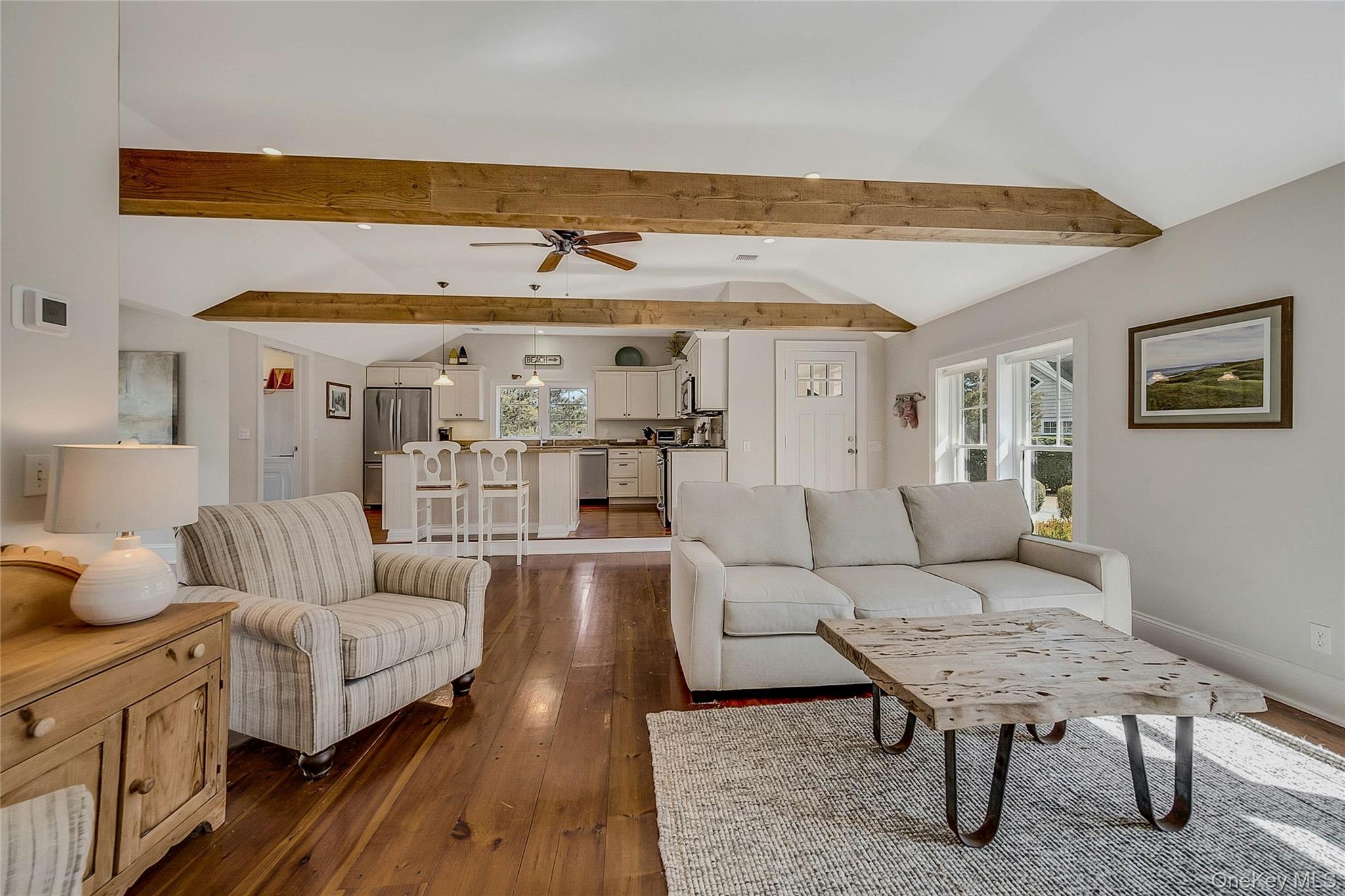 635 Strohson Road Cutchogue, NY 11935 - Photo 8 of 32 a living room with furniture and a large window