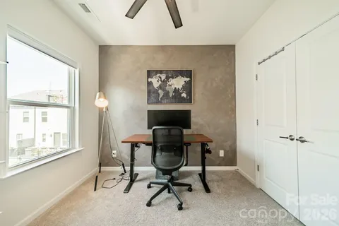 a workspace with furniture and a window