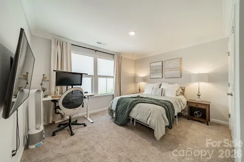 a bedroom with bed and a window