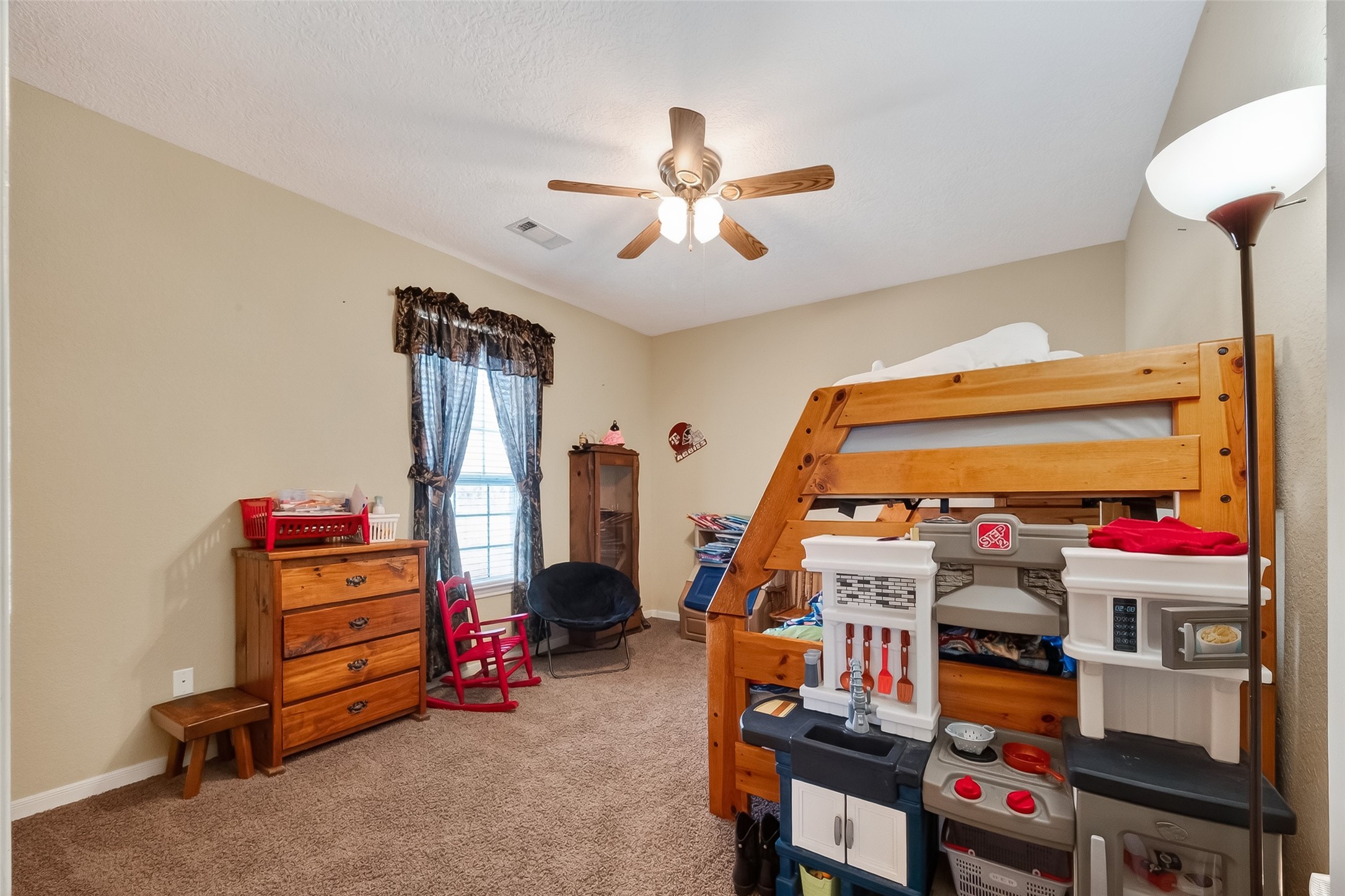3418 Barbers Hill Road Highlands, TX 77562 - Photo 38 of 50 a bedroom with furniture and a flat screen tv