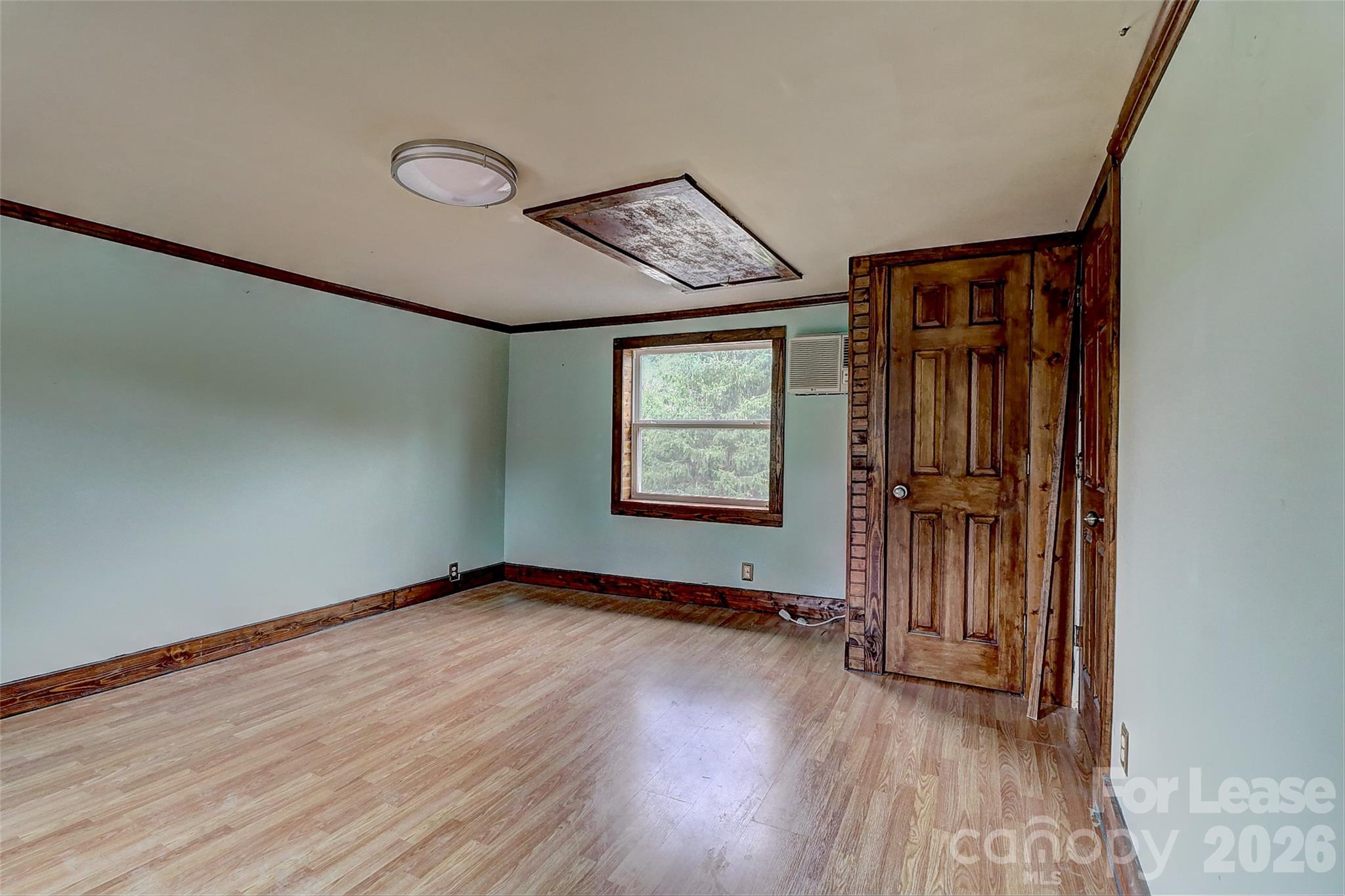 3601 Kidd Lane Charlotte, NC 28216 - Photo 13 of 19 an empty room with wooden floor closet and windows