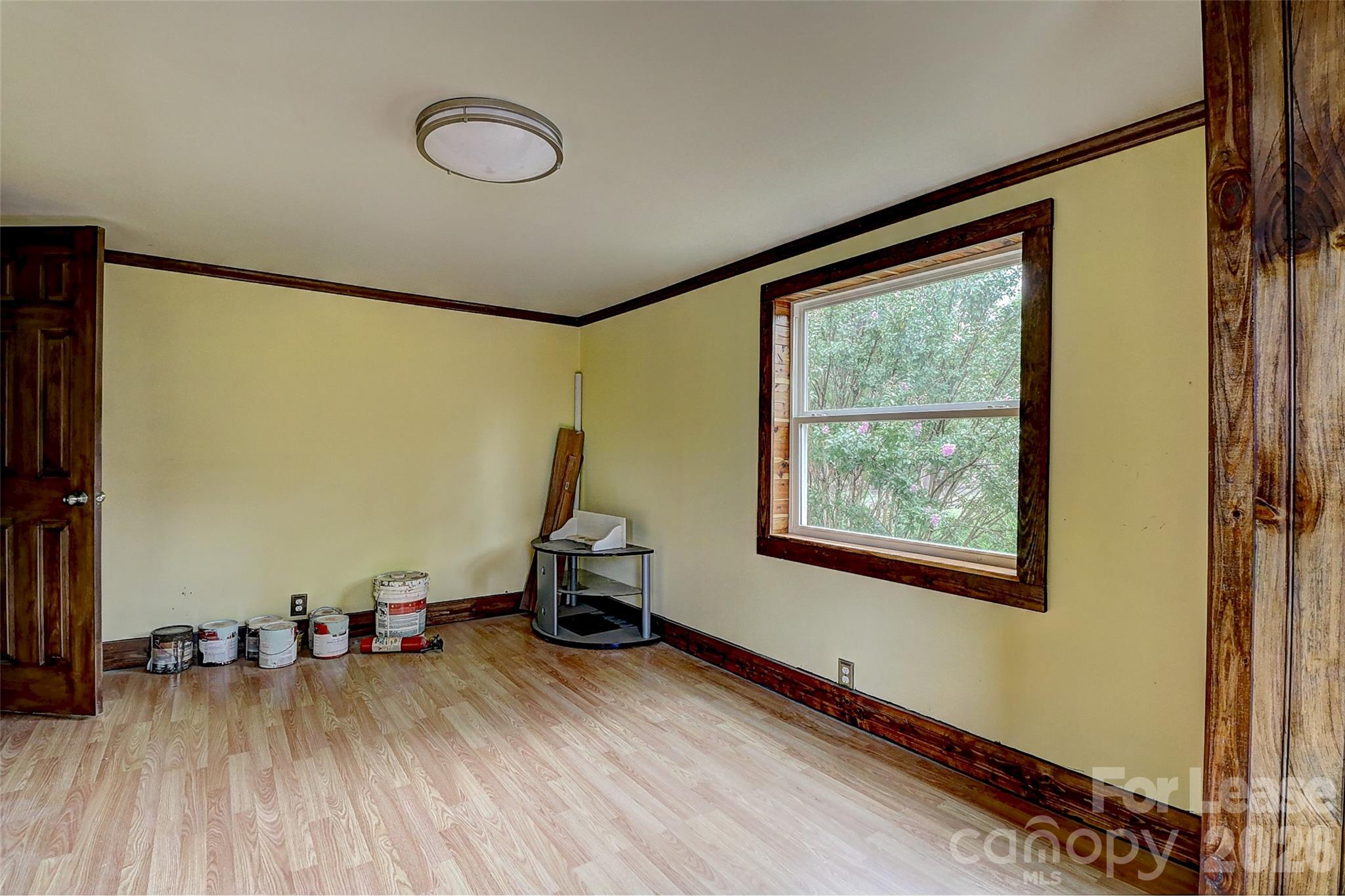 3601 Kidd Lane Charlotte, NC 28216 - Photo 15 of 19 a view of a room with wooden floor and windows