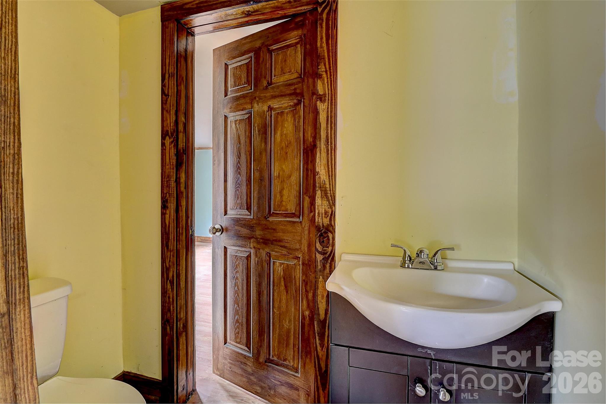 3601 Kidd Lane Charlotte, NC 28216 - Photo 16 of 19 a bathroom with a sink and a mirror