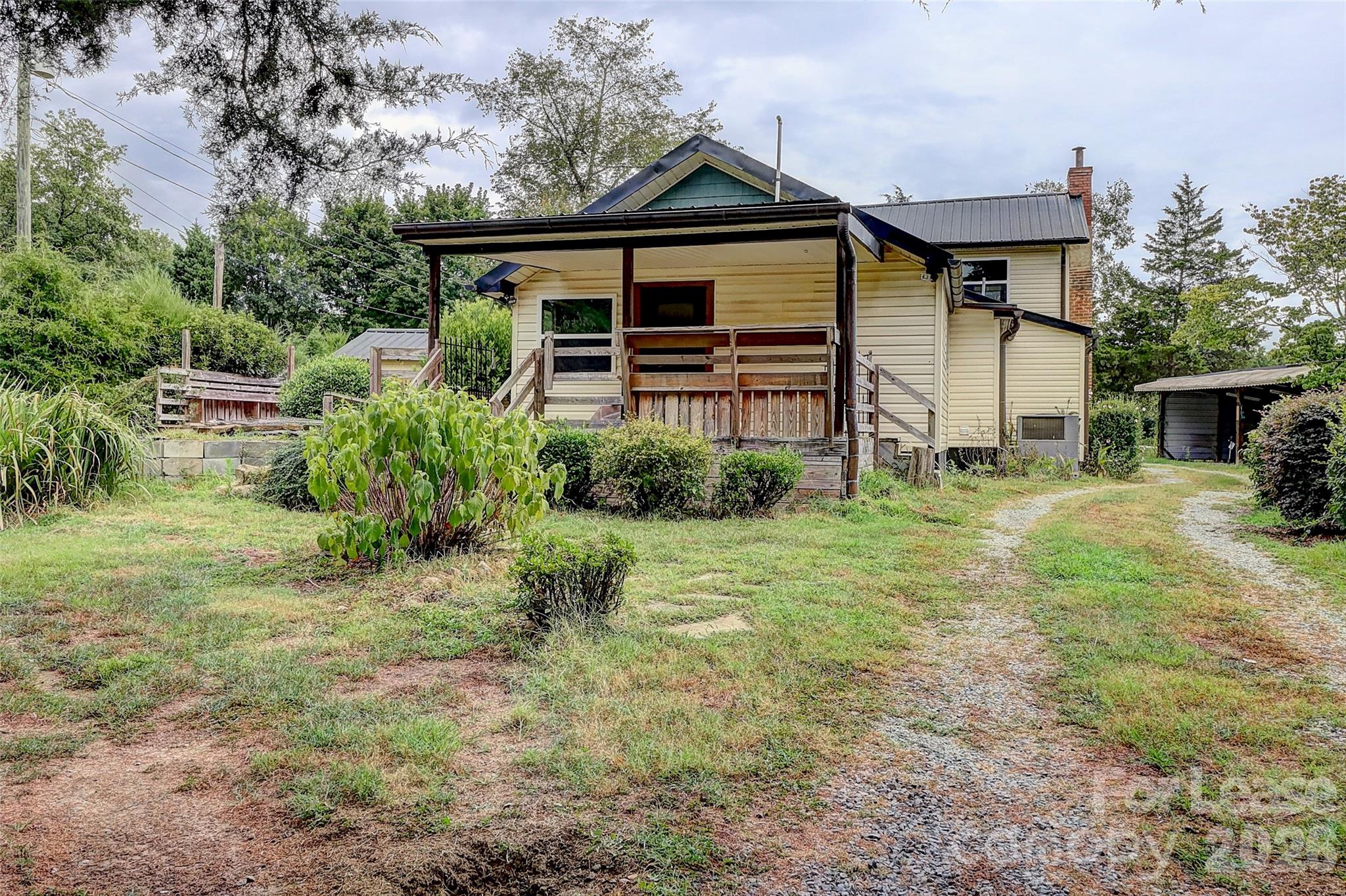 3601 Kidd Lane Charlotte, NC 28216 - Photo 19 of 19 a front view of a house with garden