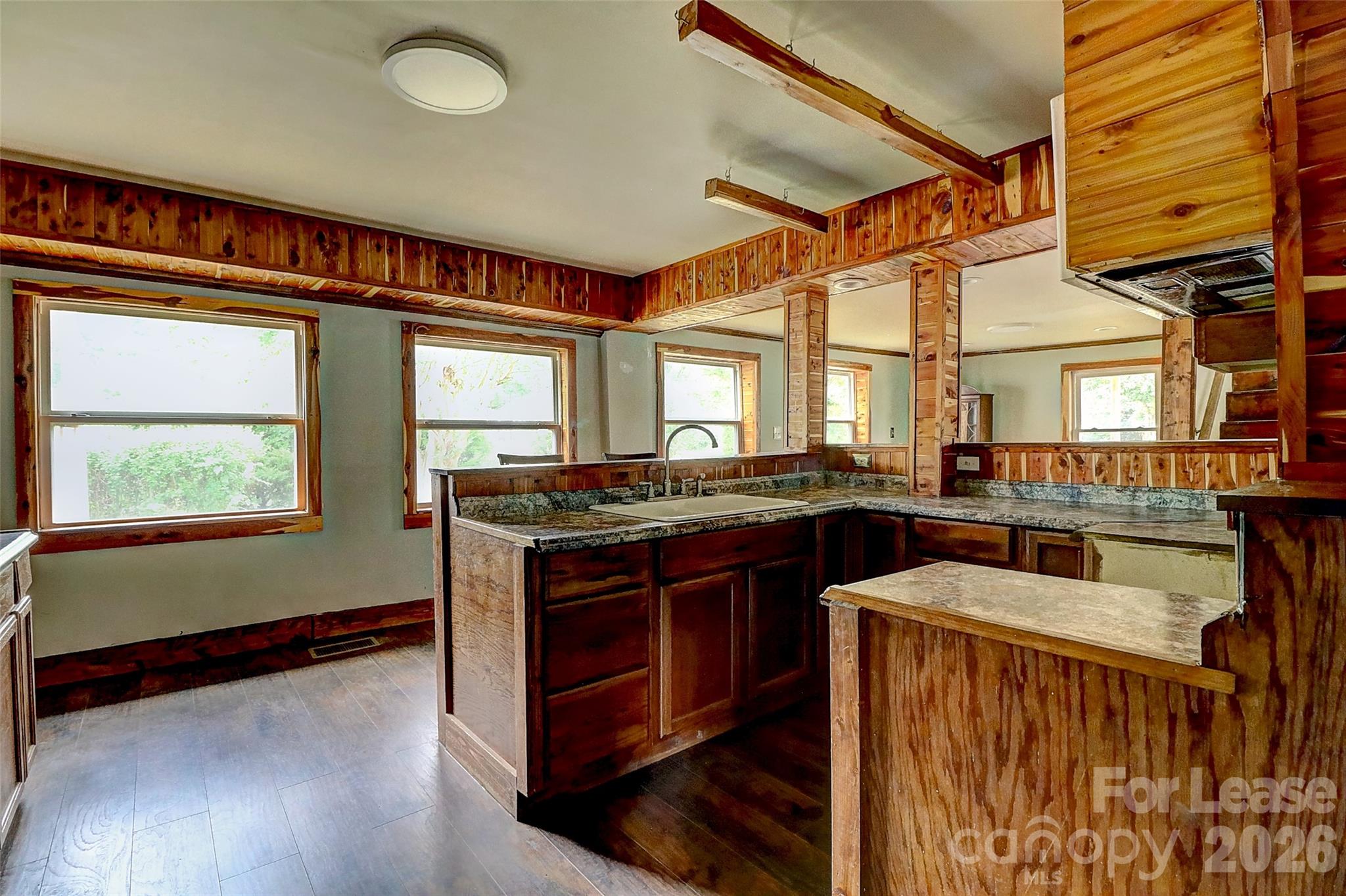 3601 Kidd Lane Charlotte, NC 28216 - Photo 6 of 19 a kitchen with stainless steel appliances granite countertop a stove and a sink