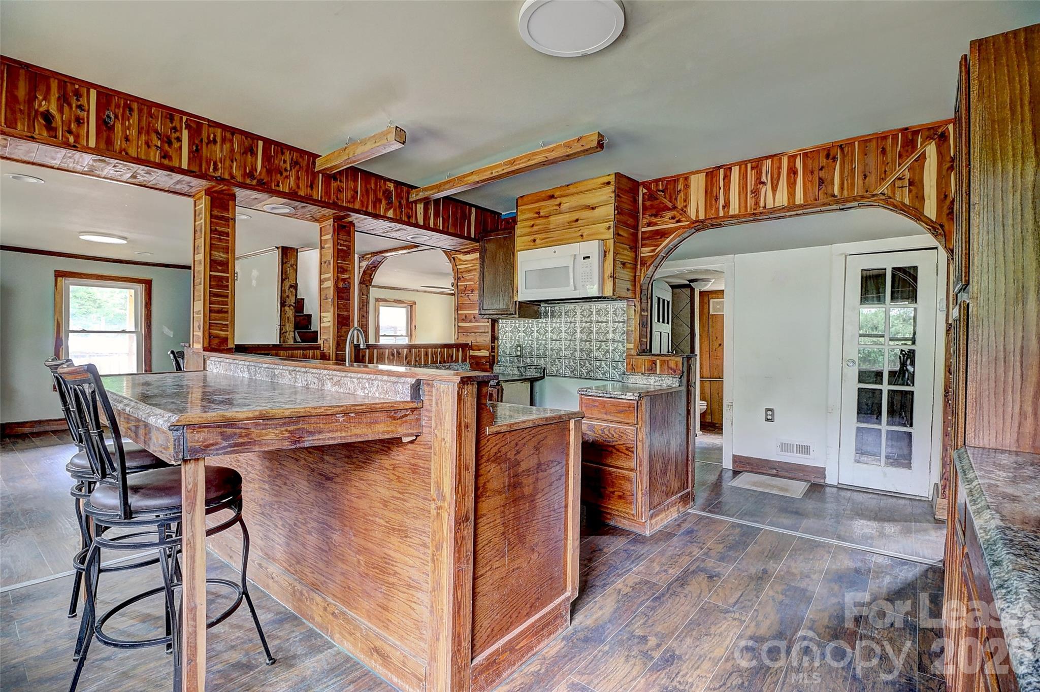 3601 Kidd Lane Charlotte, NC 28216 - Photo 7 of 19 a view of kitchen with cabinets and wooden floor