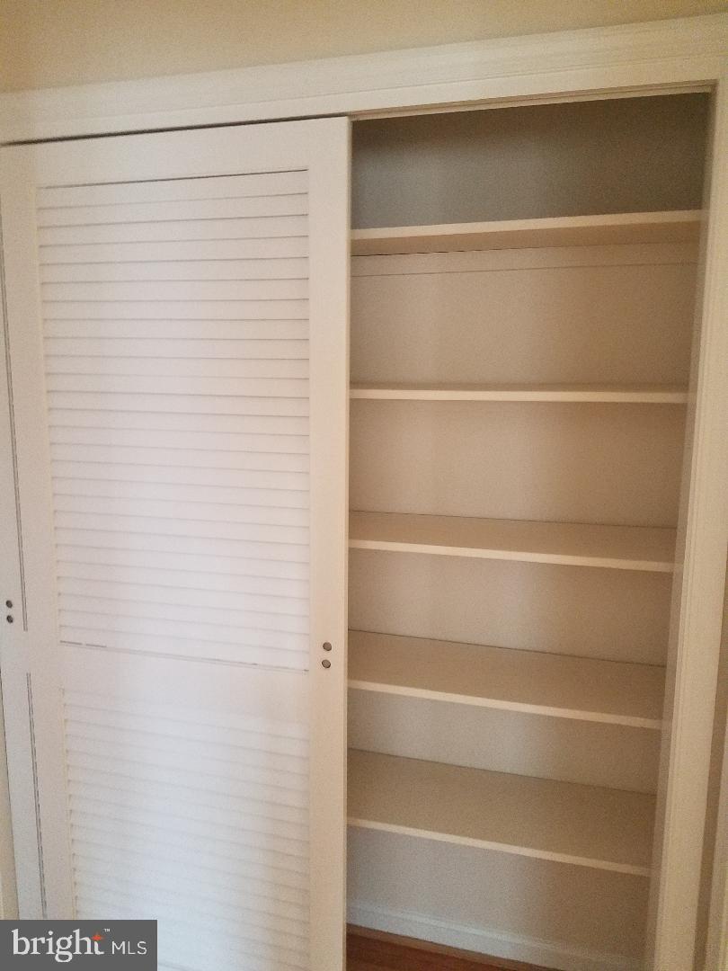 1152 Wimbledon Drive McLean, VA 22101 - Photo 22 of 37 a view of walk in closet with empty racks