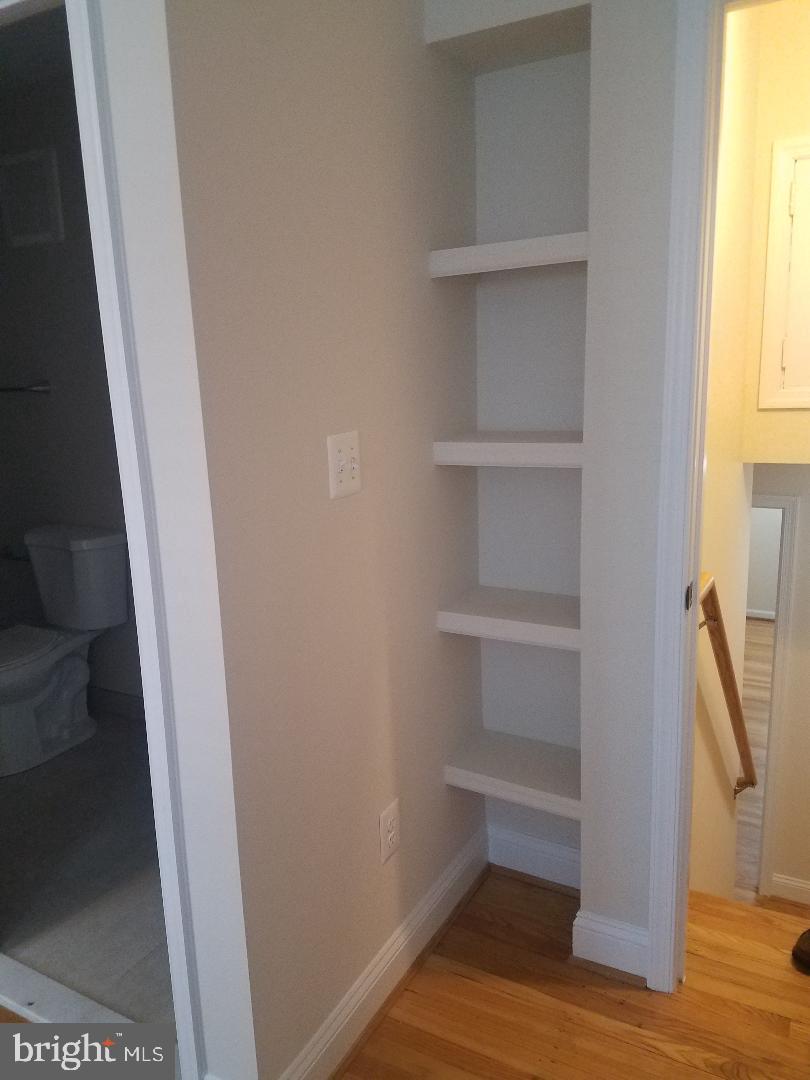 1152 Wimbledon Drive McLean, VA 22101 - Photo 32 of 37 a view of walk in closet with empty racks