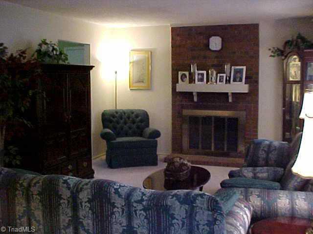 830 Bundaberg Lane Rural Hall, NC 27045 - Photo 3 of 9 Other. Large living room has beautiful fireplace with gas log insert.
