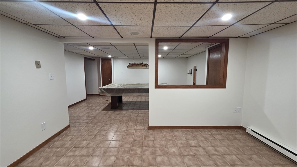13 East Brookfield Road North Brookfield, MA 01535 - Photo 20 of 28 a view of a hallway with wooden floor and a refrigerator