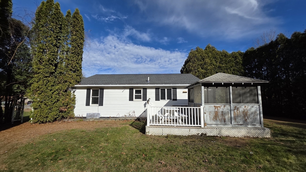13 East Brookfield Road North Brookfield, MA 01535 - Photo 3 of 28 a front view of a house with a garden