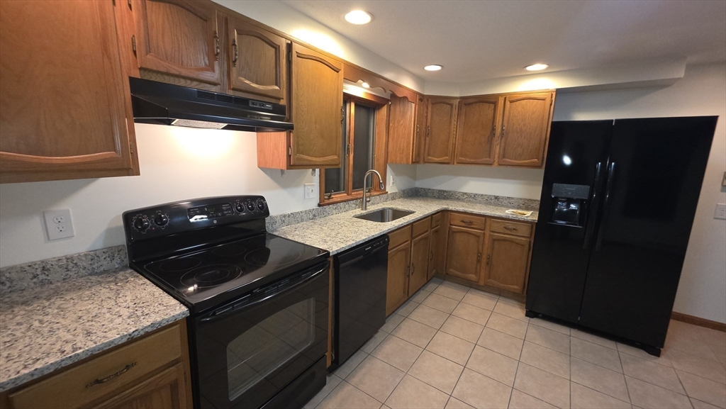 13 East Brookfield Road North Brookfield, MA 01535 - Photo 8 of 28 a kitchen with a sink appliances and cabinets