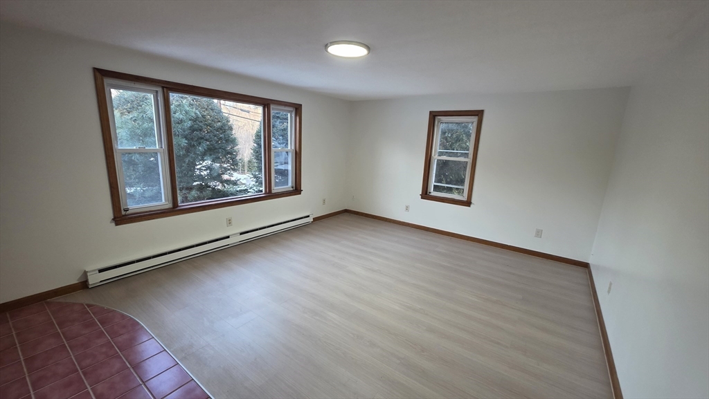 13 East Brookfield Road North Brookfield, MA 01535 - Photo 10 of 28 wooden floor in an empty room with a window