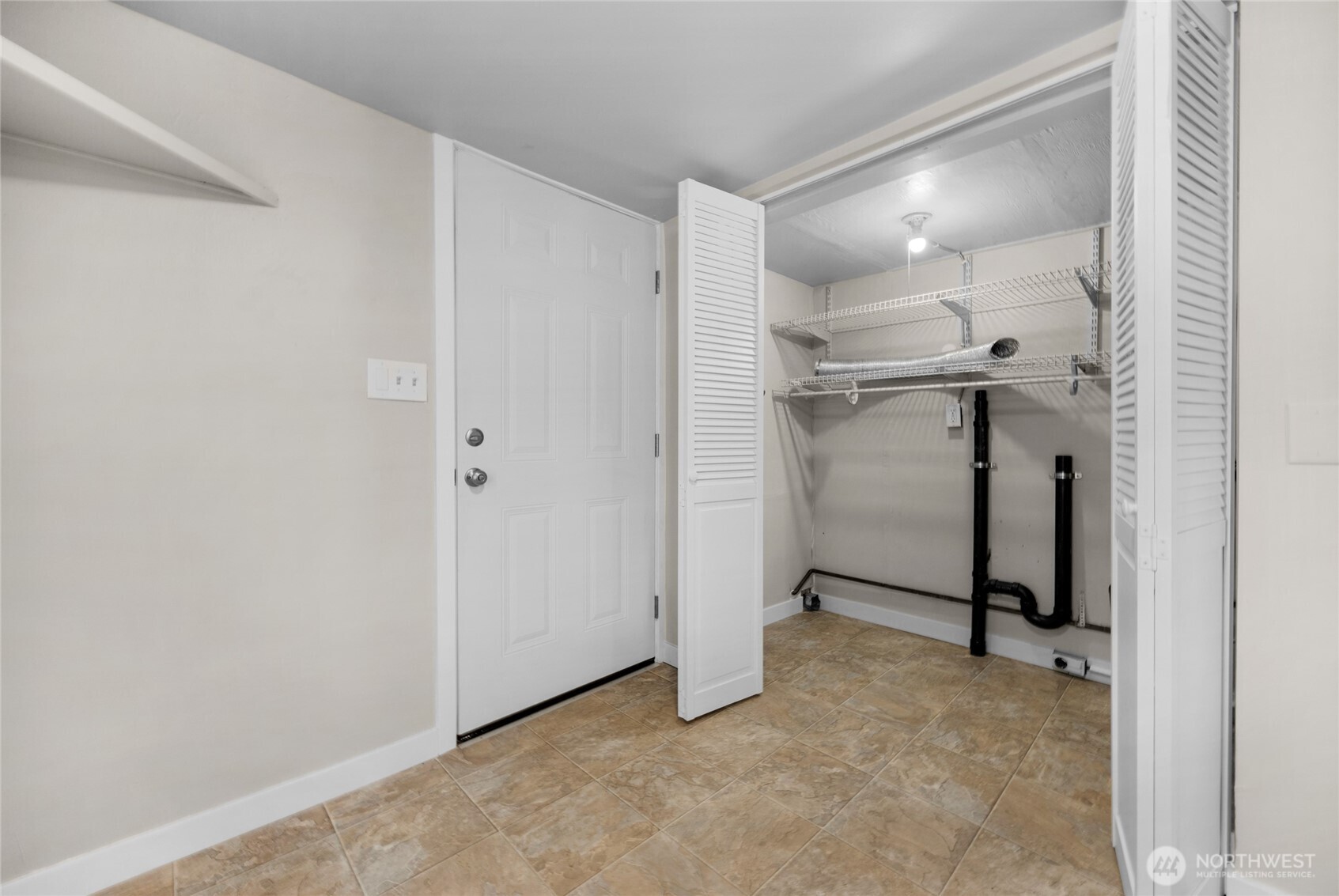 1925 Lombard Avenue, Unit A Everett, WA 98201 - Photo 20 of 25 a view of a room with a refrigerator