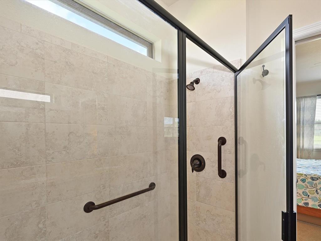 9716 58th Street East Parrish, FL 34219 - Photo 21 of 58 a bathroom with a shower