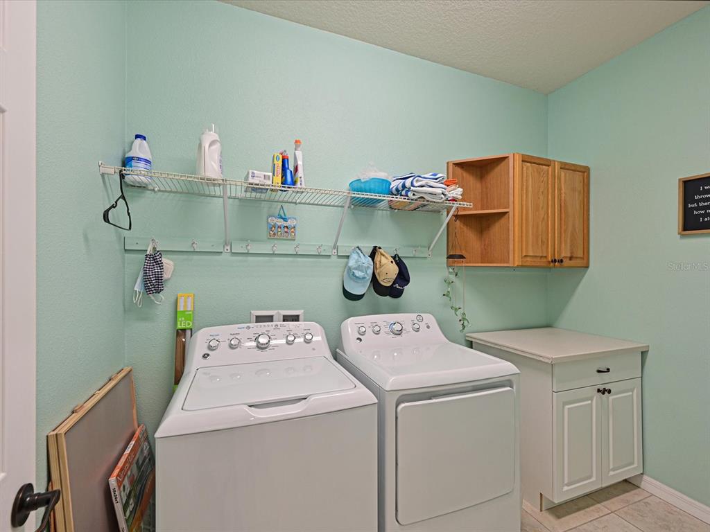 9716 58th Street East Parrish, FL 34219 - Photo 23 of 58 a utility room with dryer and washer