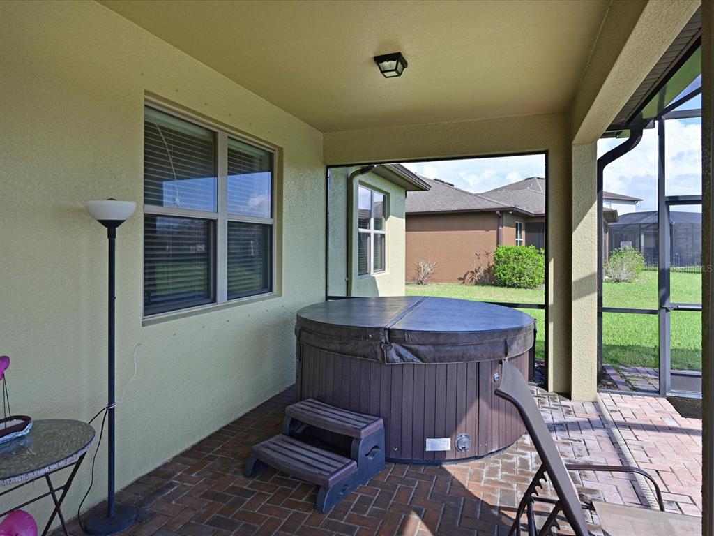 9716 58th Street East Parrish, FL 34219 - Photo 30 of 58 a view of a balcony with furniture