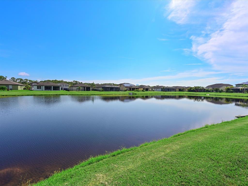 9716 58th Street East Parrish, FL 34219 - Photo 31 of 58 a view of a lake with a city view