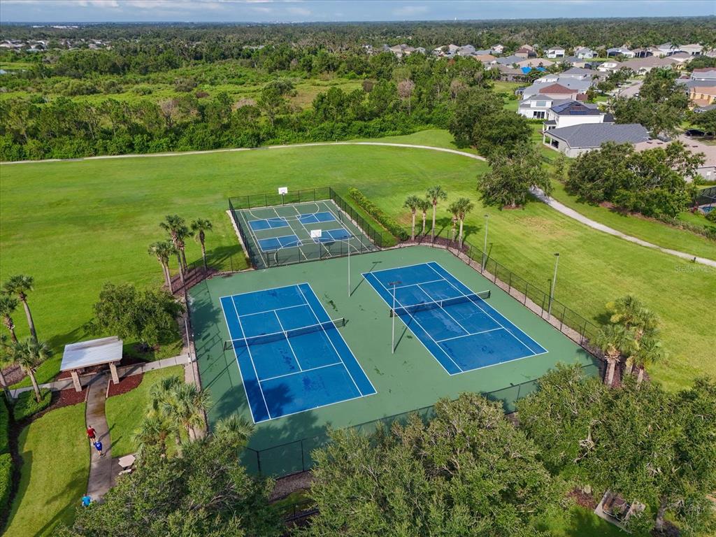 9716 58th Street East Parrish, FL 34219 - Photo 36 of 58 an aerial view of a house with a yard