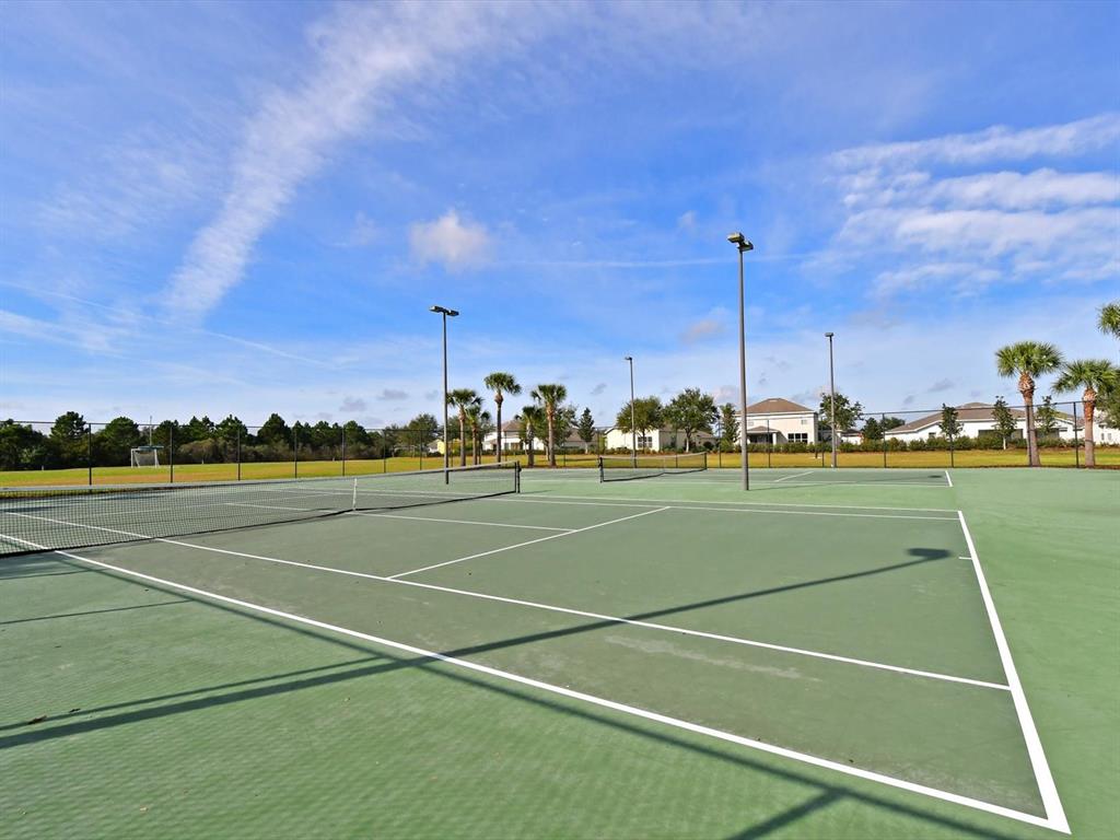 9716 58th Street East Parrish, FL 34219 - Photo 41 of 58 a view of a tennis court