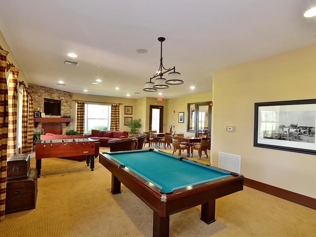9716 58th Street East Parrish, FL 34219 - Photo 44 of 58 a room with furniture pool table and a window