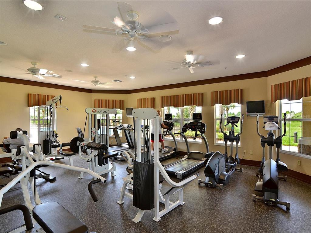 9716 58th Street East Parrish, FL 34219 - Photo 45 of 58 a view of a room with gym equipment