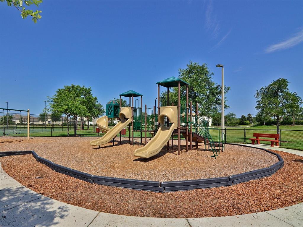 9716 58th Street East Parrish, FL 34219 - Photo 46 of 58 a view of a park with swings