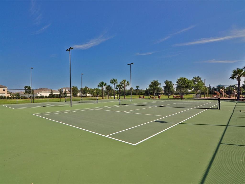 9716 58th Street East Parrish, FL 34219 - Photo 47 of 58 a view of a tennis court