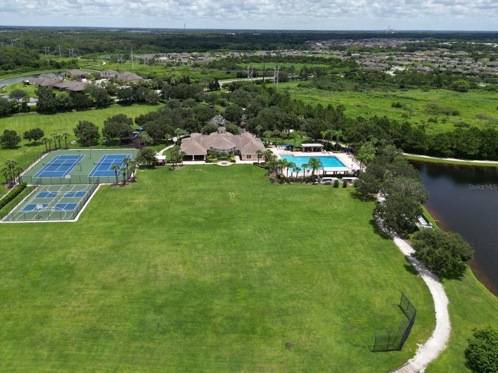 9716 58th Street East Parrish, FL 34219 - Photo 50 of 58 a view of a garden with houses