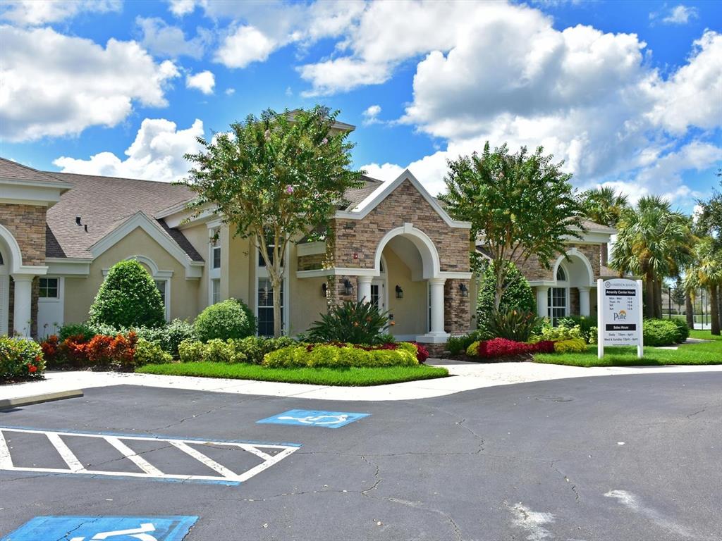 9716 58th Street East Parrish, FL 34219 - Photo 53 of 58 a front view of a house with a garden