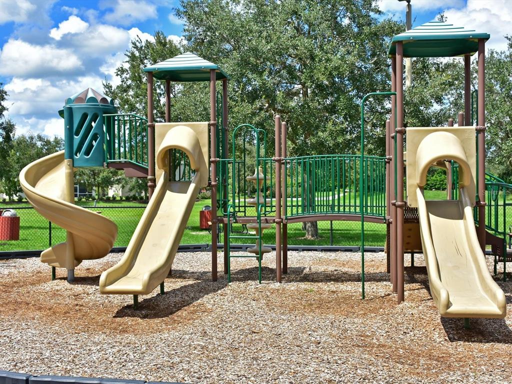 9716 58th Street East Parrish, FL 34219 - Photo 55 of 58 a view of a park with slide
