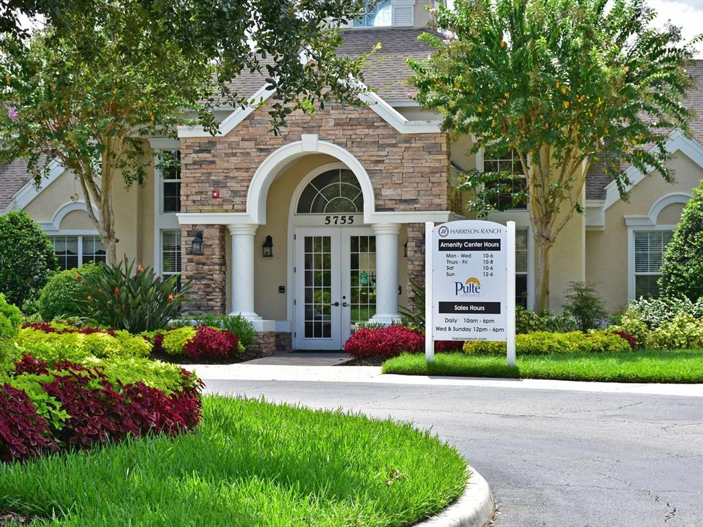 9716 58th Street East Parrish, FL 34219 - Photo 57 of 58 a front view of a house with garden