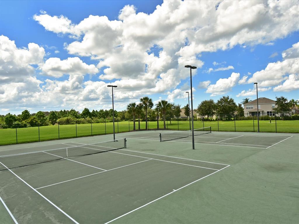 9716 58th Street East Parrish, FL 34219 - Photo 58 of 58 a view of a tennis court