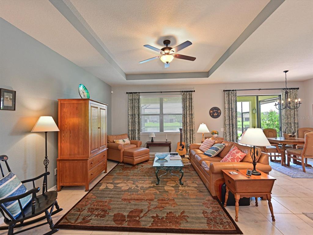 9716 58th Street East Parrish, FL 34219 - Photo 7 of 58 a living room with furniture a table and a window