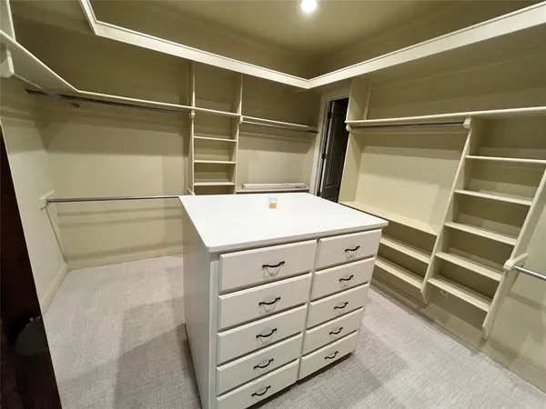 a view of a bathroom with sink and a mirror