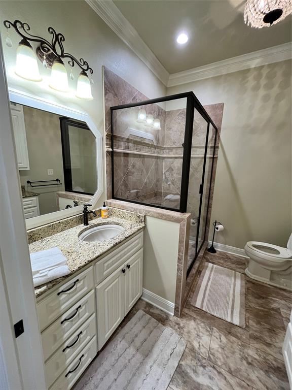 1255 County Road 3400 Emory, TX 75440 - Photo 14 of 36 a bathroom with a sink a mirror and a toilet