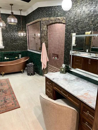 a kitchen with stainless steel appliances kitchen island granite countertop a stove a sink and a microwave