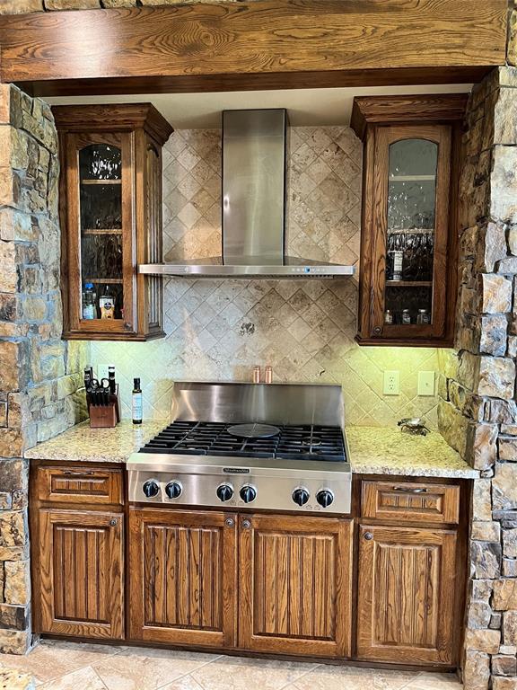 1255 County Road 3400 Emory, TX 75440 - Photo 23 of 36 a kitchen with stainless steel appliances granite countertop a stove and cabinets