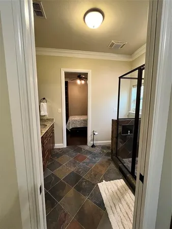a kitchen with granite countertop a refrigerator and a stove top oven