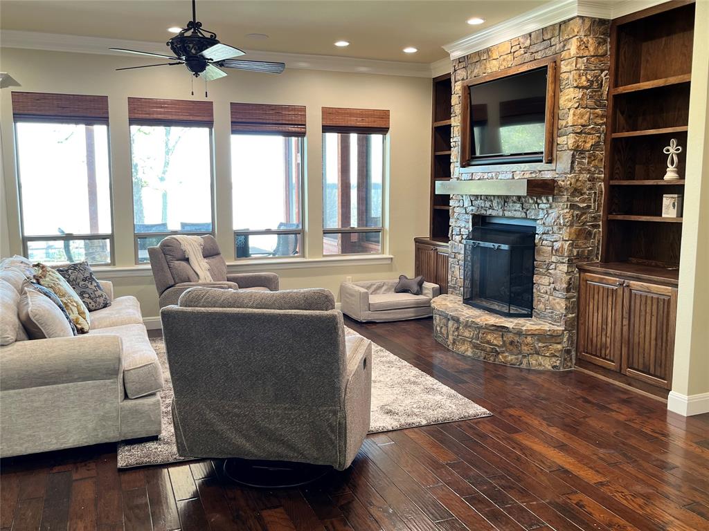 1255 County Road 3400 Emory, TX 75440 - Photo 35 of 36 a living room with fireplace furniture and a flat screen tv