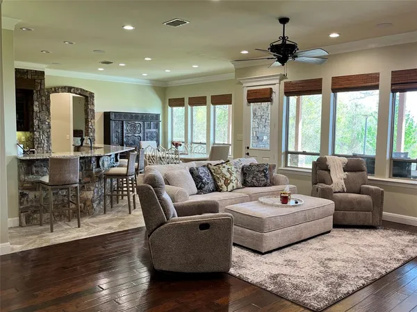 a living room with fireplace furniture and a flat screen tv