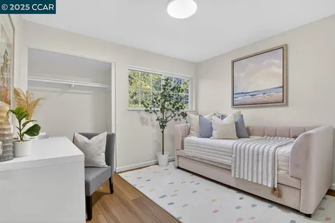 a bedroom with a bed and a potted plant