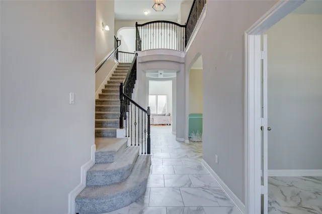 a view of entryway and hall with a hallway