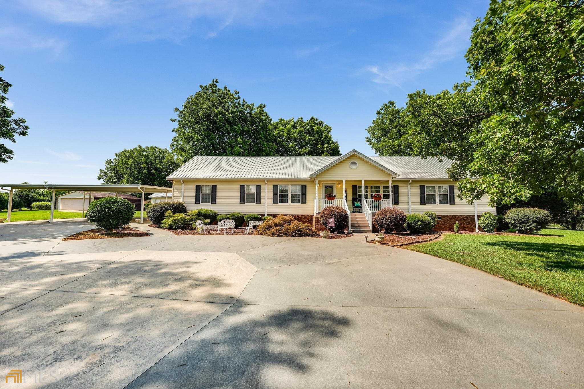 a front view of a house with yard