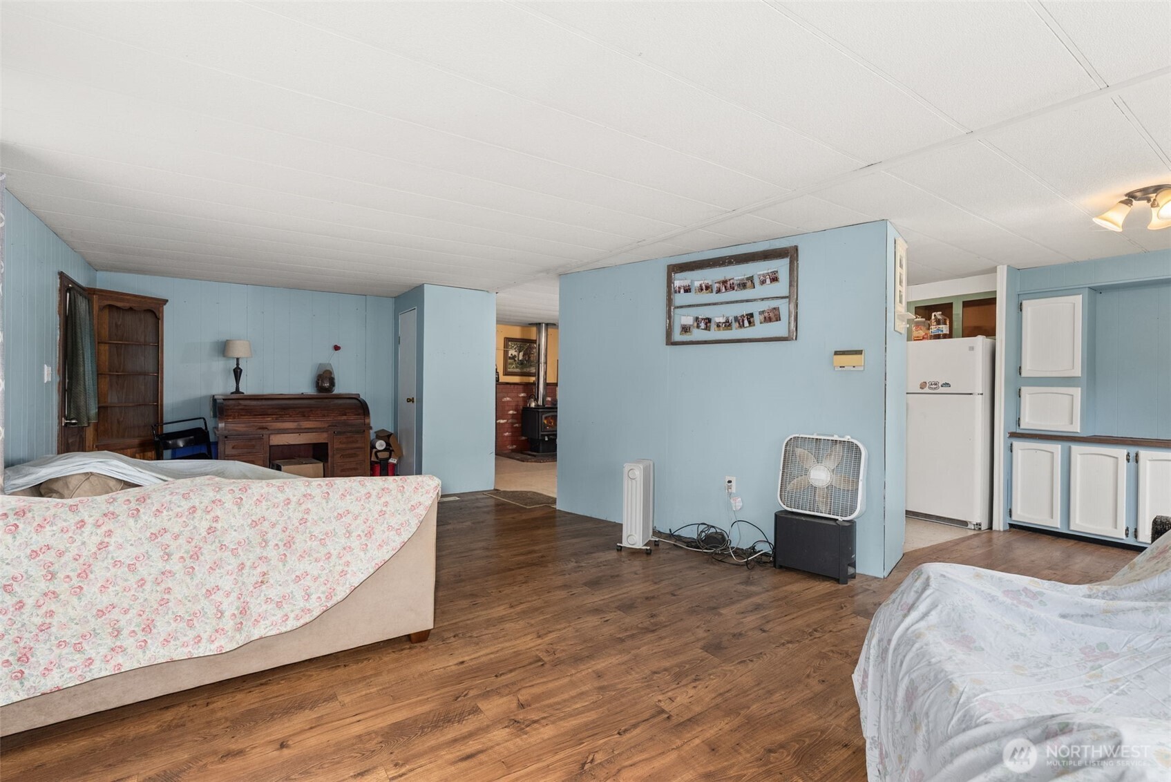 2700 Mallis Landing Road Raymond, WA 98577 - Photo 12 of 33 a bedroom with a bed and wooden floor