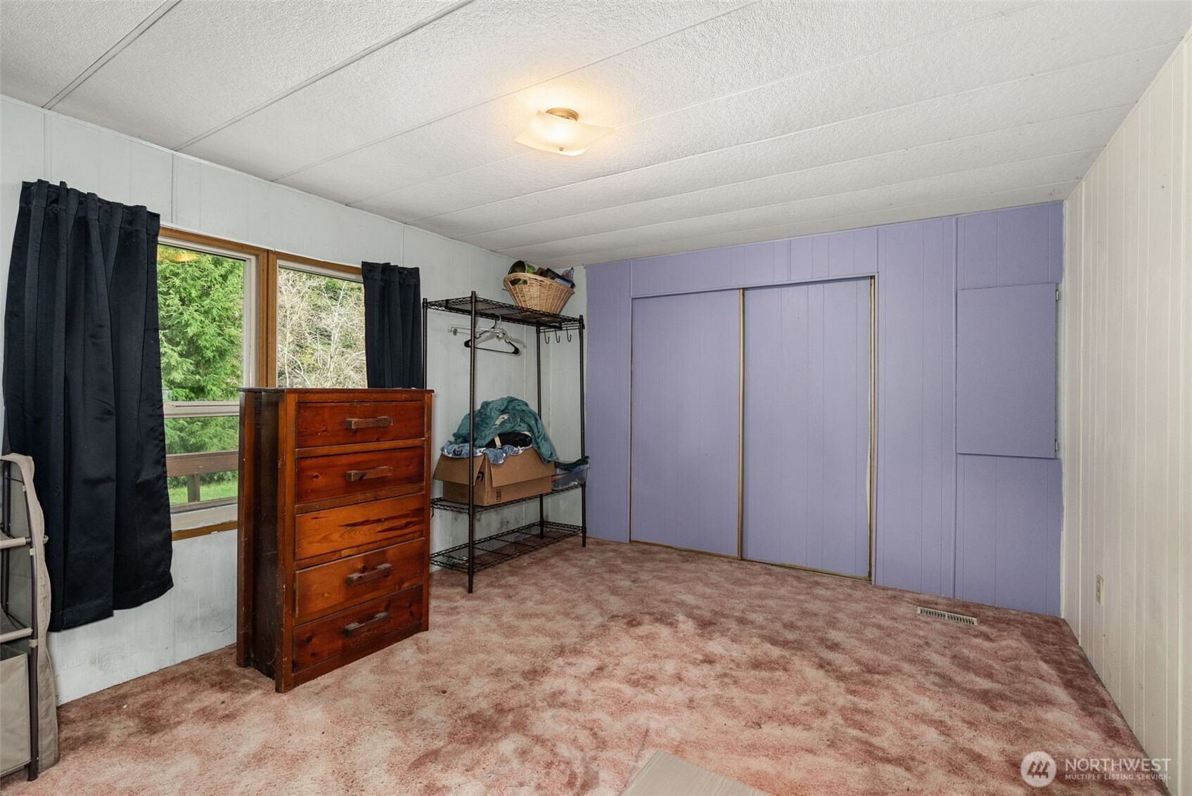 2700 Mallis Landing Road Raymond, WA 98577 - Photo 17 of 33 a bed room with a bed and a dresser