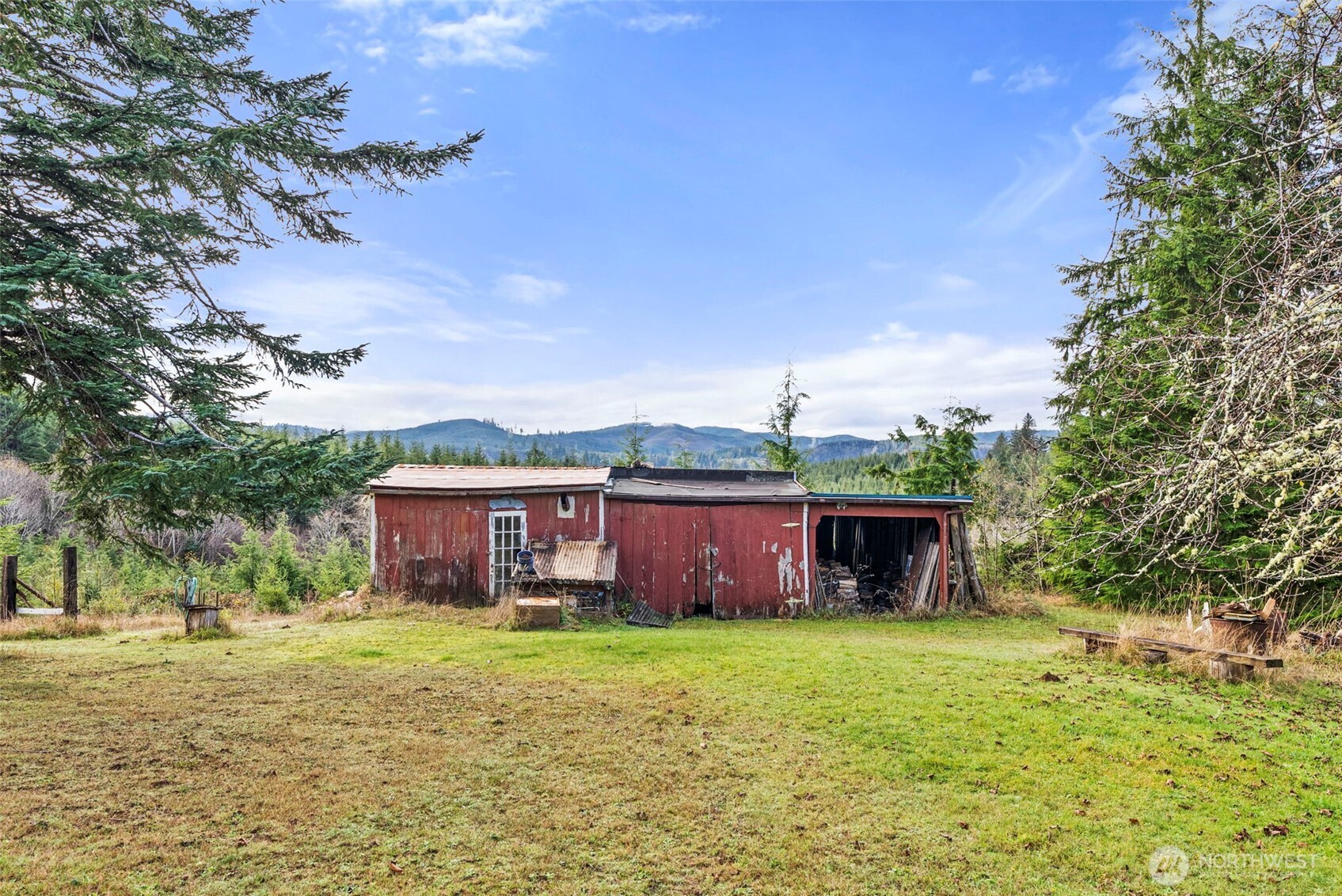 2700 Mallis Landing Road Raymond, WA 98577 - Photo 26 of 33 a front view of a house with a garden and yard