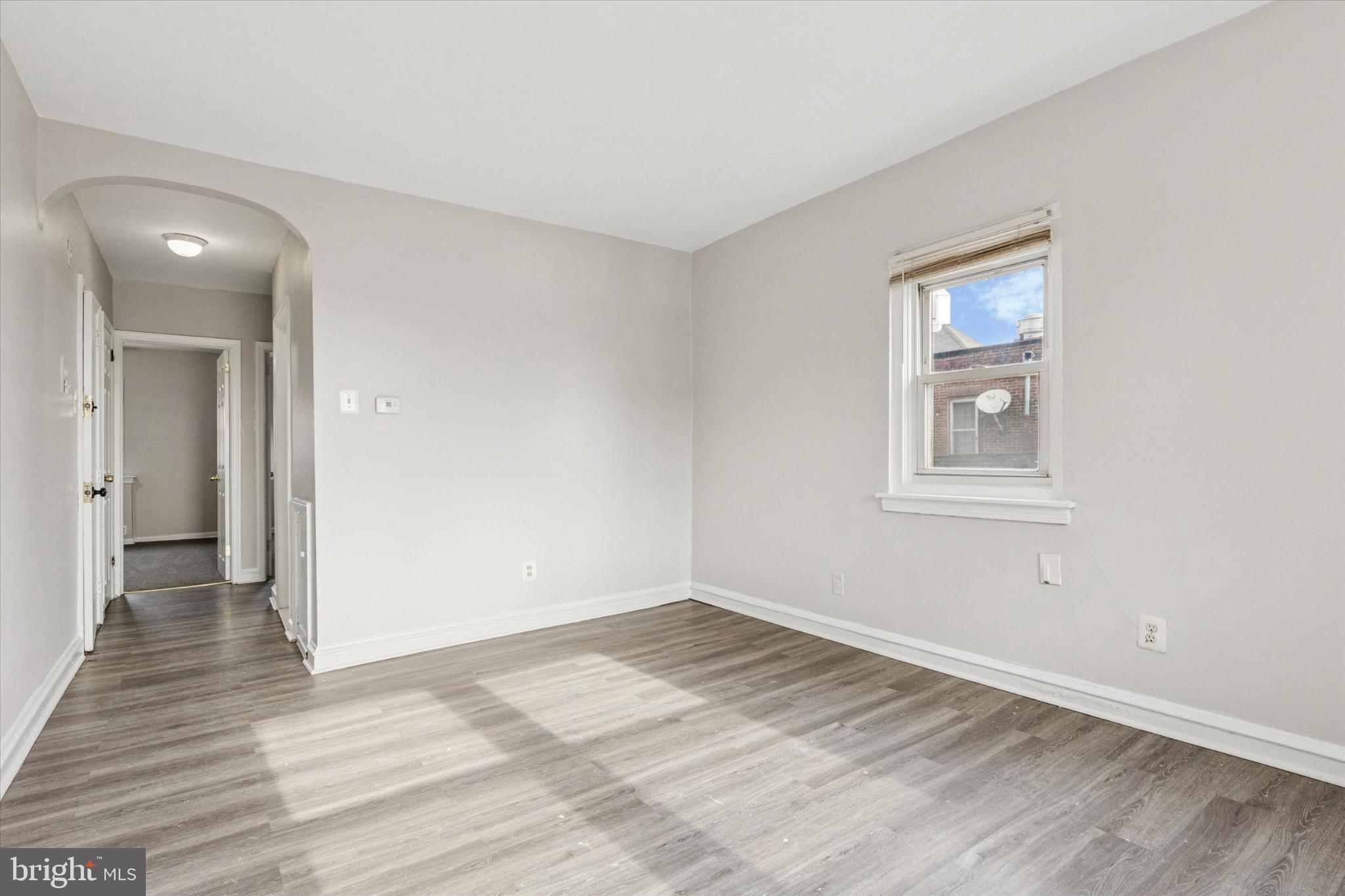 2415 80th Avenue Philadelphia, PA 19150 - Photo 17 of 35 a view of empty room with wooden floor and fan