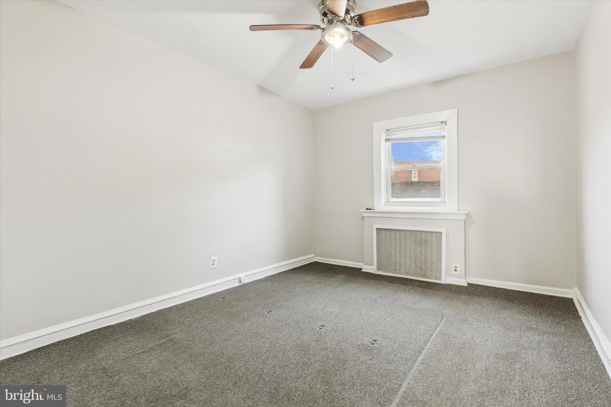 2415 80th Avenue Philadelphia, PA 19150 - Photo 21 of 35 an empty room with a window and ceiling fan